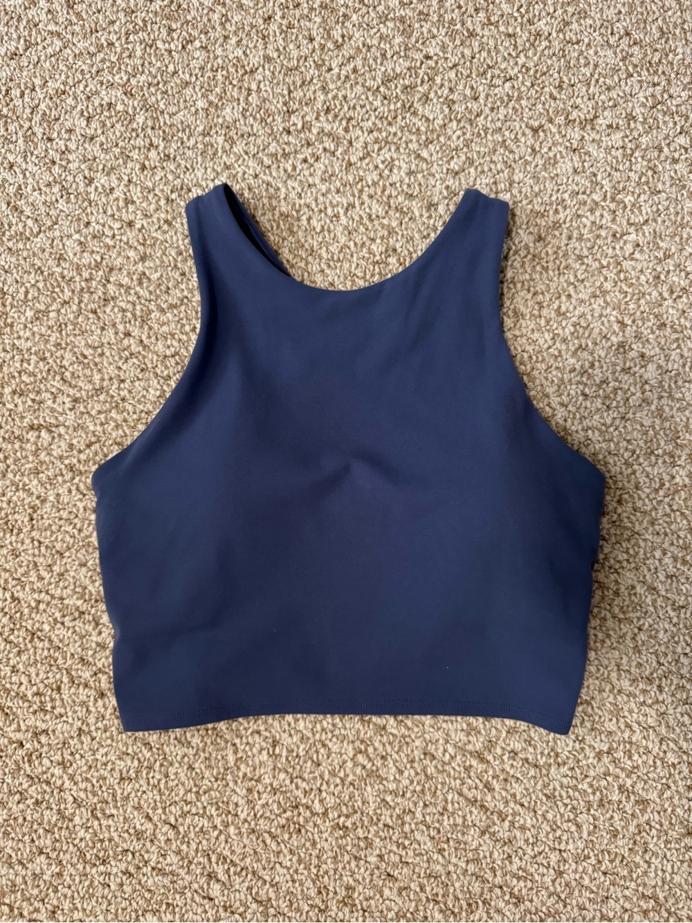 Athleta Conscious Crop bra in navy with a high-neck design